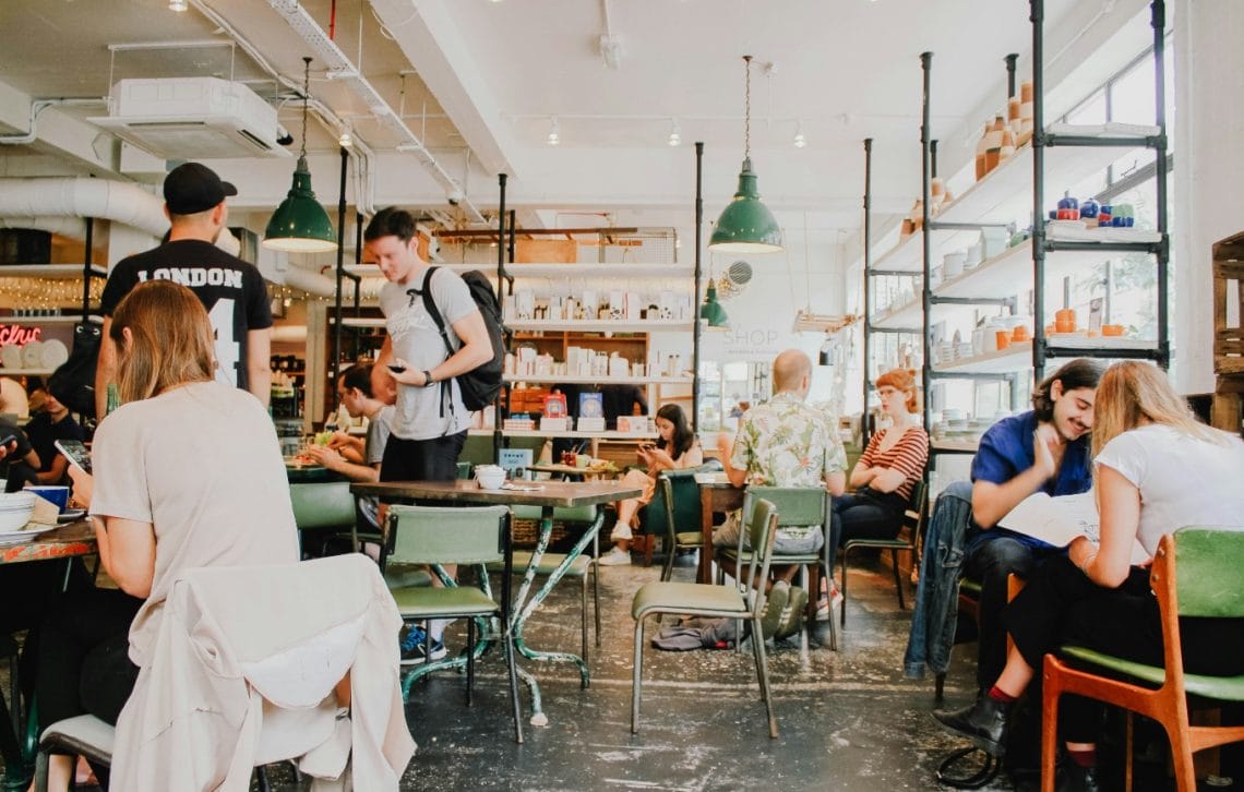 people sitting around a community cafe